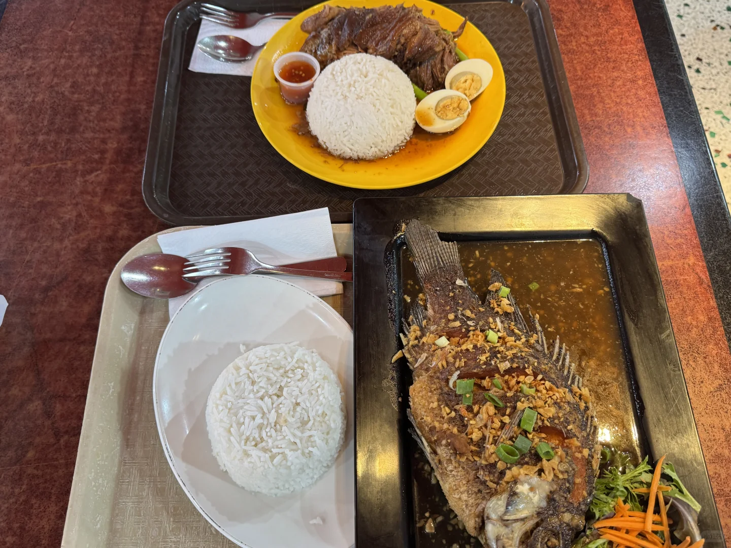 For under $20, you can enjoy crispy garlic fried fish with rice at Yummy Thai Food in Sydney's Sussex Shopping Centre food court.